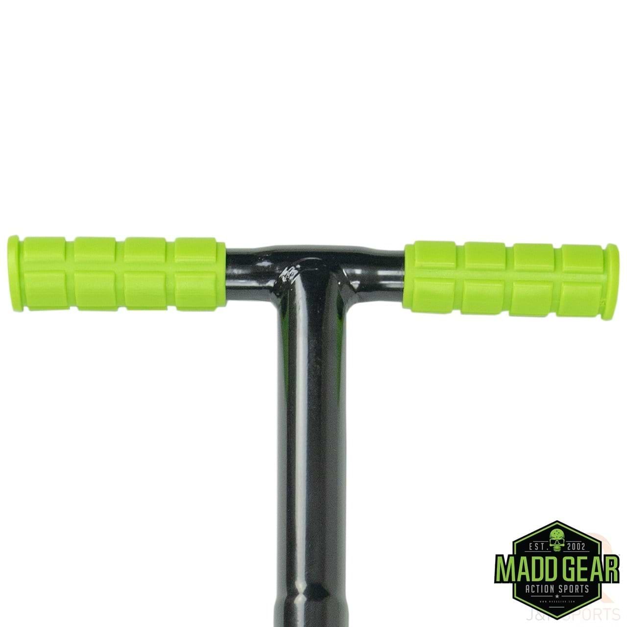 A close-up of a Madd Gear MGP Pogo Stick handlebar in black, featuring bright lime grips. The durable handlebar is crafted with a high-grade alloy stem, and the Madd Gear logo is positioned in the bottom right corner.