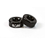 A pair of black, round spacer rings designed for CNC aluminium stunt scooters feature the "DARE" logo on one ring. These long-lasting and durable components are displayed against a simple white background.