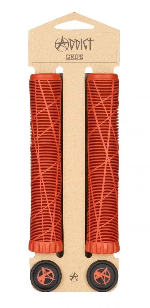 The Addict OG Bloody Red Stunt Scooter Grips - 180mm come as a pair, packaged in a cardboard holder. These grips have a geometric pattern and are made from super soft TPR for enhanced comfort. The packaging prominently features the "Addict" brand name at the top and includes matching bar ends at the bottom.
