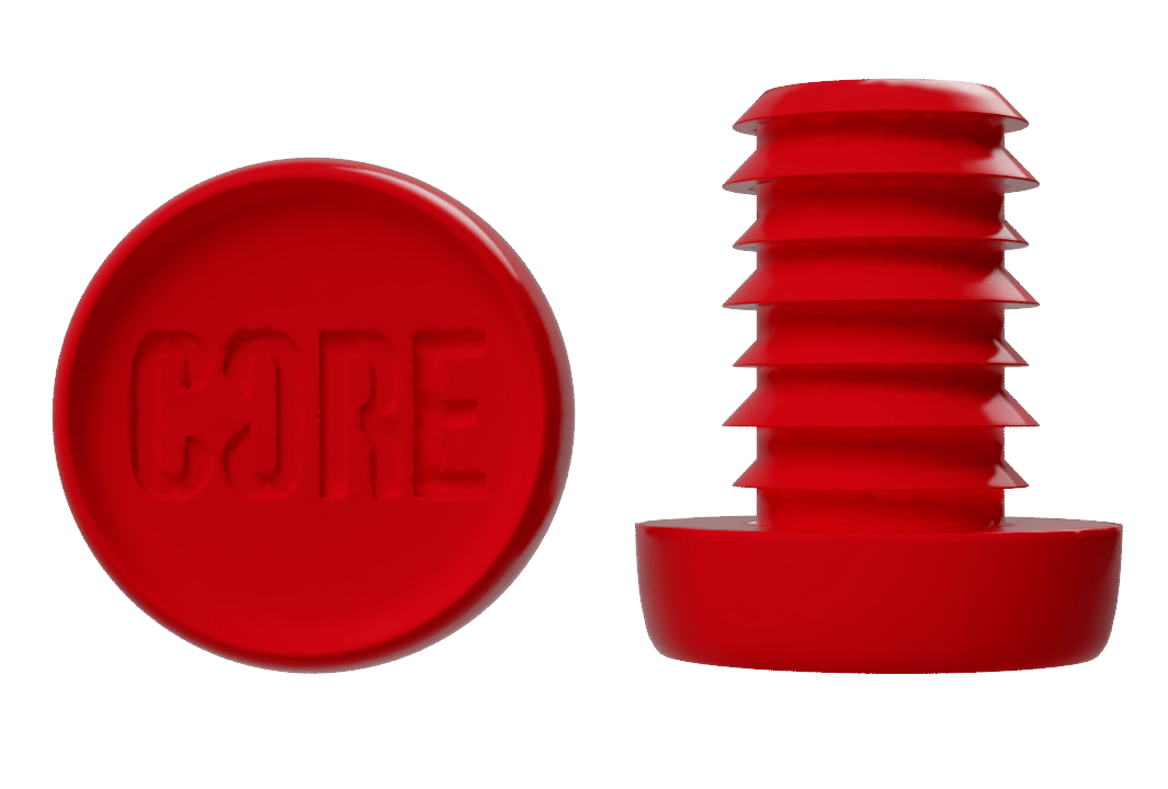 A premium quality resin object in red, with the word "CORE" embossed on the flat surface, is paired with a grooved red cylindrical piece for sleek and durable bar ends, part of the CORE Standard Scooter Bar Ends - Red collection.