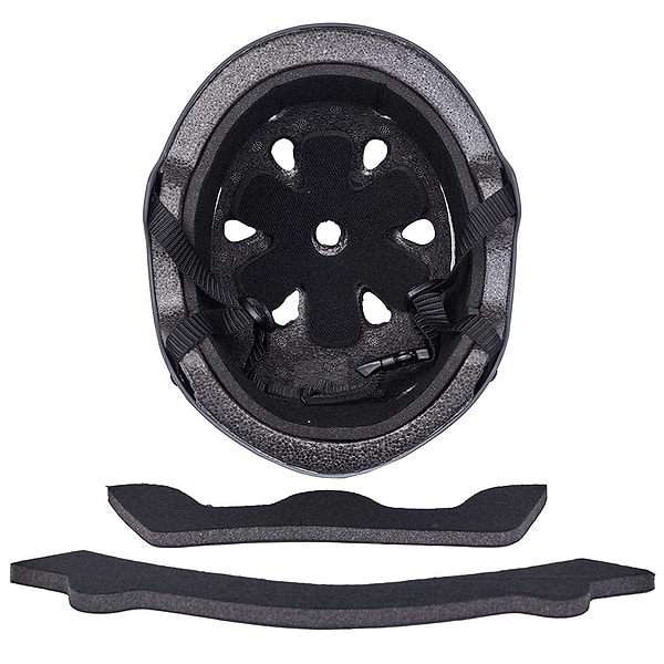A top-down view of the CORE Action Sports Skate / Scooter Helmet - Black by CORE, showing black foam padding, ventilation holes, adjustable straps, and two removable foam inserts below this low-profile helmet.