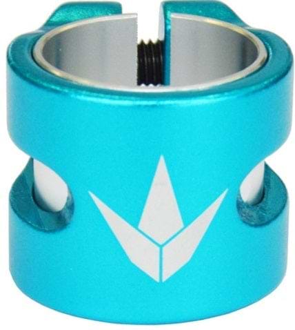 The Blunt Envy Twin Slit 2 Bolt Oversized Scooter Clamp - Teal is a lightweight aluminium piece featuring a white geometric logo on the front and twin vertical slots on both sides. Designed for versatility, it includes a threaded hole at the top, perfect for securely fastening items, making it an excellent choice for stunt scooter enthusiasts.