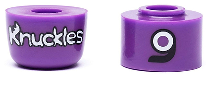 Two purple wheels are displayed, each designed for skateboards or roller skates. The left features "Orangatang Knuckles" in white with a wrench-shaped 'K', while the right displays a bold '9' in black and white. These wheels pair perfectly with Orangatang's high-rebound Knuckles Purple Longboard Bushings - Medium 90A, ensuring an ultra-smooth ride.