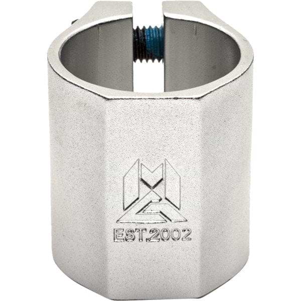 The Madd Gear MGP MFX Extreme 2 Bolt Oversized Stunt Scooter Clamp, made from robust 6061 alloy, is finished in silver and designed with a top bolt. It features an engraved logo along with "EST. 2002" beneath it, delivering exceptional clamping power in its streamlined cylindrical shape with a flat front.