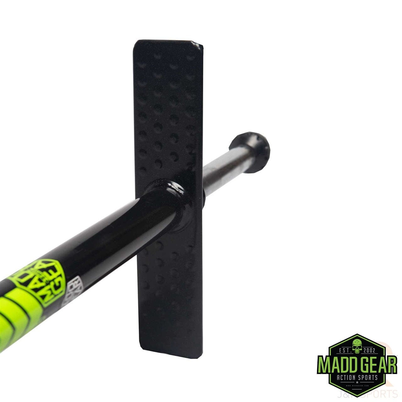 Close-up of the Madd Gear MGP Pogo Stick in Black/Pink, featuring a black handlebar with textured rectangular grips and a neon green label on its high-grade alloy stem. The prominent Madd Gear (MGP) logo is visible in the lower right corner, highlighting its high rebound urethane formula.
