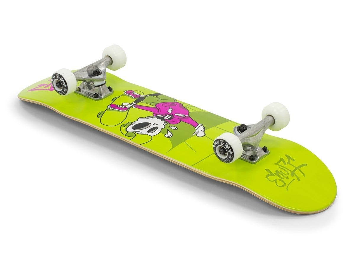 The Enuff Skully Green Complete Skateboard - 7.75" x 31.5" from Enuff is lime green with white wheels, featuring a cartoon character in a pink outfit holding a skateboard. This entry-level skateboard is ideal for beginners and boasts bold black and yellow graffiti-style text on the underside of its 7-ply maple deck near the tail.