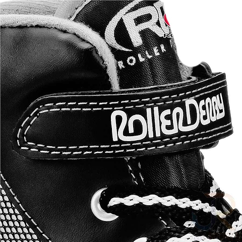 Close-up of the Roller Derby Firestar V2 quad roller skate in black and grey, featuring white laces and a Velcro strap labeled with the "Roller Derby" brand. The prominently displayed logo showcases the Roller Derby name on the side, highlighting its sporty shoe design.