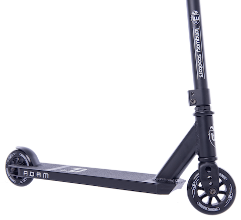 The Longway Adam Complete Stunt Scooter - Black is shown in a close-up, highlighting its lightweight black frame, two small wheels, and durable metal construction. The deck has a textured surface with "ADAM" printed on it, and the handlebar exhibits branding and design features perfect for beginner riders.