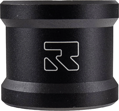 The Root Industries Lithium 2 Bolt Oversized Stunt Scooter Clamp in black is a cylindrical device crafted with aircraft-grade aluminum and a matte finish, prominently displaying the white stylized "R" logo at its center. It features slightly beveled edges on the top and bottom, adding to its sleek durability.