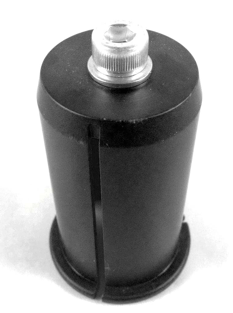 Logic HIC Shim Kit - Chrome by Logic, a black cylindrical 35mm canister with a metal cap and a side slot resembling an HIC shim, shown on a plain white background.