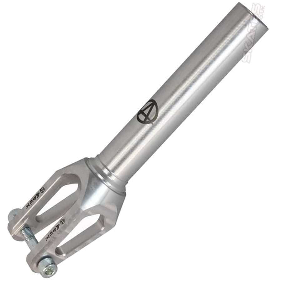 The Apex Quantum SCS/HIC Stunt Scooter Forks in Raw Silver by Apex are a metallic silver scooter fork with a cylindrical stem and an open-back design near the base. Known for their durability as an upgrade, they feature bolt fittings and have a small logo printed on the side.