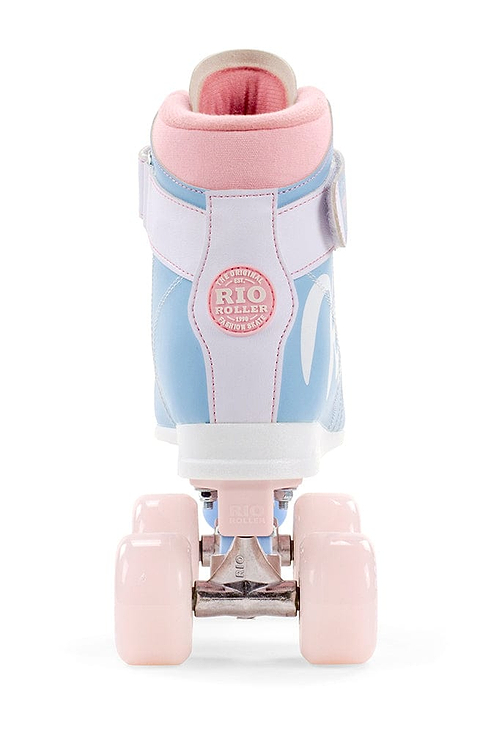 A single Rio Roller Milkshake Quad Roller Skate - Cotton Candy is displayed from the back, showcasing its vintage style in pastel blue and pink hues. The pink wheels enhance its design, while a round patch embossed with "Rio Roller" adorns the heel area. The figure skate style makes a striking impression against the pristine white background.