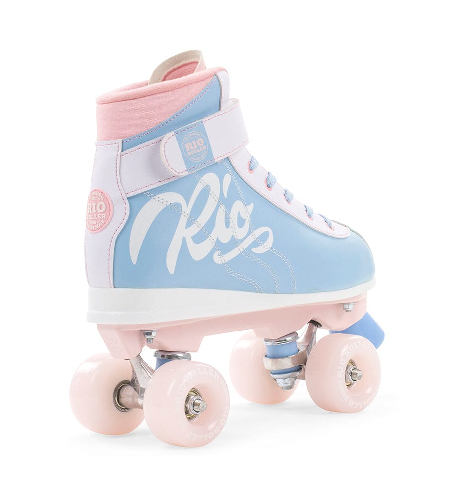 A single Rio Roller Milkshake Quad Skate, named "Cotton Candy," showcases a figure skate style with a pastel design, pink wheels, and a blue-pink boot. The brand's name "Rio" decorates the side against a crisp white backdrop.