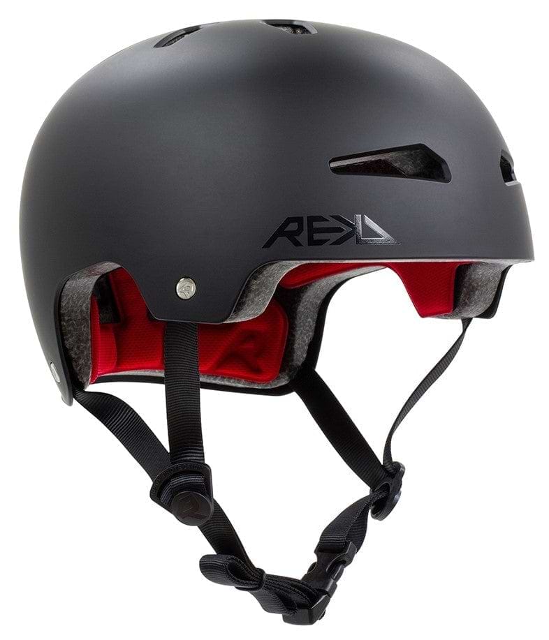 Introducing the REKD Elite 2.0 Skate / Scooter Helmet in sleek black—a matte-finished action sports helmet equipped with ventilation slits and a bold red interior lining. It features an adjustable chin strap with buckles and proudly displays the REKD logo on the side, distinguishing it as one of the finest certified helmets on the market.