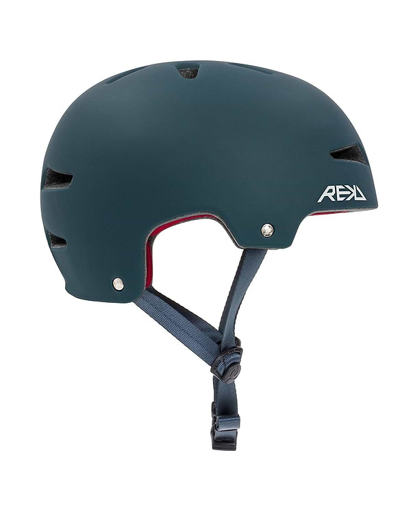 A blue REKD Ultralite In-Mold Skate/Scooter Helmet, featuring angular ventilation slots and a vibrant red interior lining. Ideal for action sports, it includes an adjustable black chin strap with a buckle for secure fastening. The helmet's sleek design prominently displays the REKD logo in white text on the side.