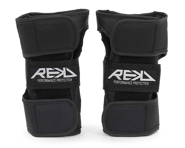 Two black REKD Skate Protection Wrist Guards, adorned with "REKD" on the front straps, are crafted for action sports. They include adjustable velcro straps for a secure fit and offer 360° protection, ensuring both comfort and safety.