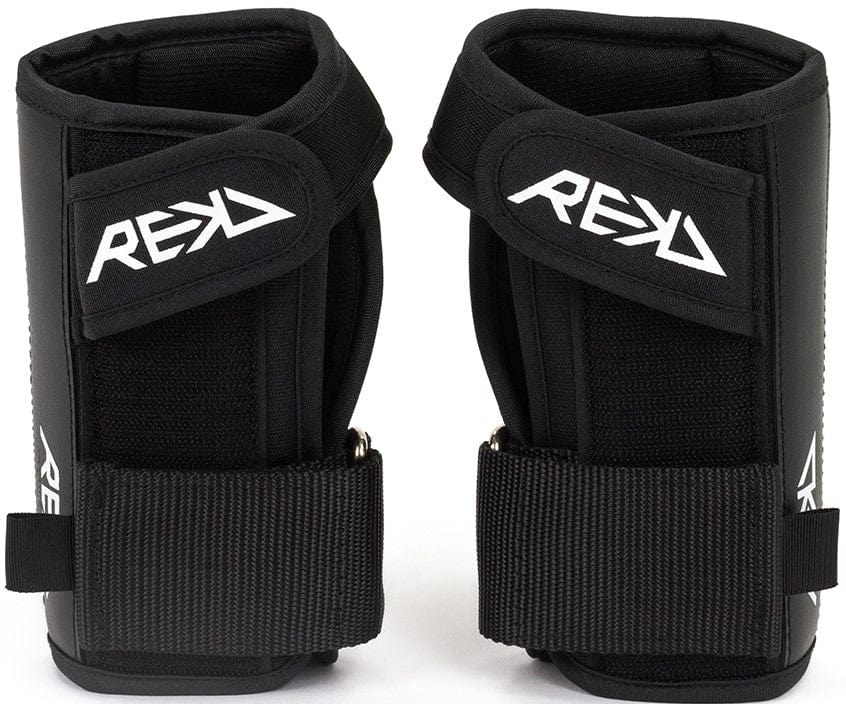 Introducing the REKD Pro Skate Protection Wrist Guards in Black, showcasing the iconic "REKD" logo in white. These wrist guards are designed with ergonomics in mind, featuring adjustable straps and padded supports to provide optimal protection during extreme sports.