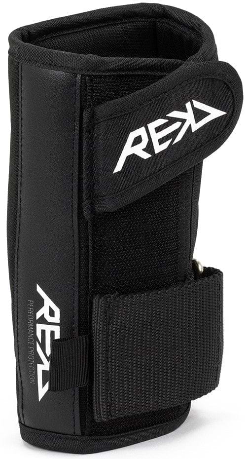 Introducing the REKD Pro Skate Protection Wrist Guards in black, designed with an ergonomic fit ideal for extreme sports enthusiasts. These guards come with Velcro straps and feature a stylized REKD logo in white, positioned diagonally. Experience padded lining for maximum comfort and protection during your adventures.