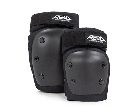 The REKD Youth Heavy Duty Double Skate Protection Pad Set in black features a robust design with hard shell caps and adjustable velcro straps adorned with the REKD logo. These pads are essential for ensuring safety during activities such as skating or construction work.