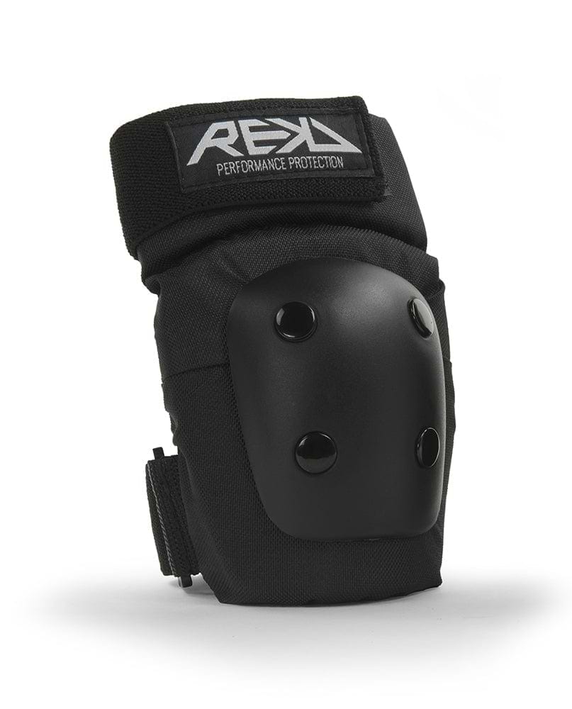 Black knee pad featuring a hard protective cap and adjustable straps with the "REKD" logo prominently displayed on top. As part of the REKD Junior Heavy Duty Triple Skate Protection Pad Set - Black, it provides robust protection for extreme sports, ensuring safety during intense activities.