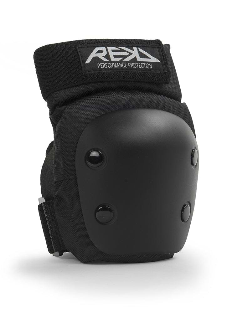 The REKD Junior Heavy Duty Triple Skate Protection Pad Set in black features knee pads with a hard protective shell and adjustable straps, making it ideal for extreme sports protection. The fabric prominently displays the "REKD" brand name, ensuring quality and safety.