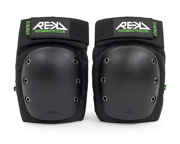 Introducing the REKD Energy Ramp Skate Protection Knee Pads - Black, designed with hard protective shells and impact foam for ultimate protection. These black knee pads offer adjustable straps for a snug fit and proudly feature "REKD" alongside "Performance Protection" on the bold green and black label.