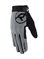 The REKD Status Skate Protection Glove in gray features a large "R" logo on the back and provides an ergonomic fit with an adjustable wrist strap. Its textured palm ensures optimal grip, while its sleek, modern design is touchscreen-friendly, making it a perfect accessory for sports or outdoor activities.