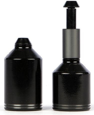 The image features two cylindrical objects with a glossy finish. The one on the left is capped and shorter, while the one on the right is taller with an extended cylindrical section and a smaller top piece. Made from 7075 T6 Heat Treated Aluminium, these Ethic DTC Aluminium Stunt Scooter Pegs in Raw Silver boast a metallic and sleek appearance.