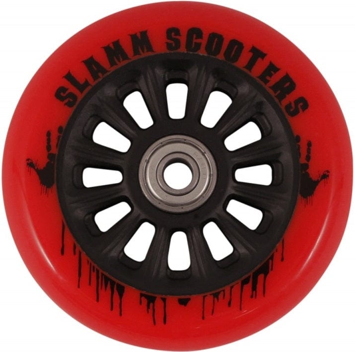 A close-up of the Slamm Nylon Core 110mm Scooter Wheel - Red showcases its appealing design. The wheel, perfect for stunt scooter riders, features a striking red outer section with a black core adorned with multiple spokes. A unique black paint splatter pattern enhances the text on the wheel, while ABEC 9 Chrome Bearings ensure smooth performance.