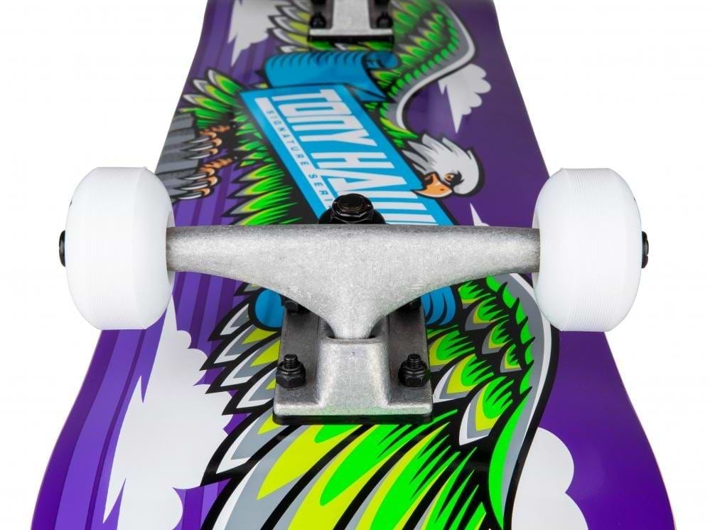 The Tony Hawk 180 Series Wingspan Complete Skateboard, measuring 7.75" x 31", showcases a striking design with green and yellow wings alongside a white bird of prey set against a purple background. This complete skateboard is equipped with white wheels, silver trucks, and a robust 7-ply maple deck to ensure optimal performance.