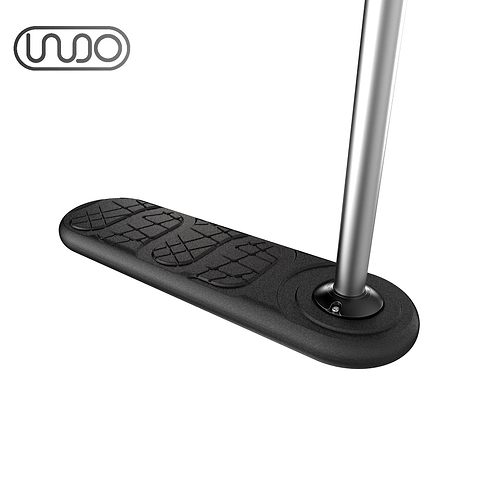 Picture of the INDO 570mm Indoor Trampoline Stunt Scooter in black, featuring a foot deck with embossed shoe tread patterns designed to enhance riding performance. A metal handlebar stem is visible on the right side, with the "INDO" logo prominently displayed in the top left corner. This sleek and modern design is perfect for stunt scooter enthusiasts.