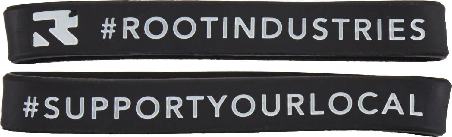 Adorn your wrist with two stylish black Root Industries Scooter Wrist Bands, featuring contrasting white text that embodies their scooter-inspired appeal. The top band proudly highlights "#ROOTINDUSTRIES," while the bottom one motivates with "#SUPPORTYOURLOCAL." An ideal accessory for fans of Root Industries and passionate scootering enthusiasts.