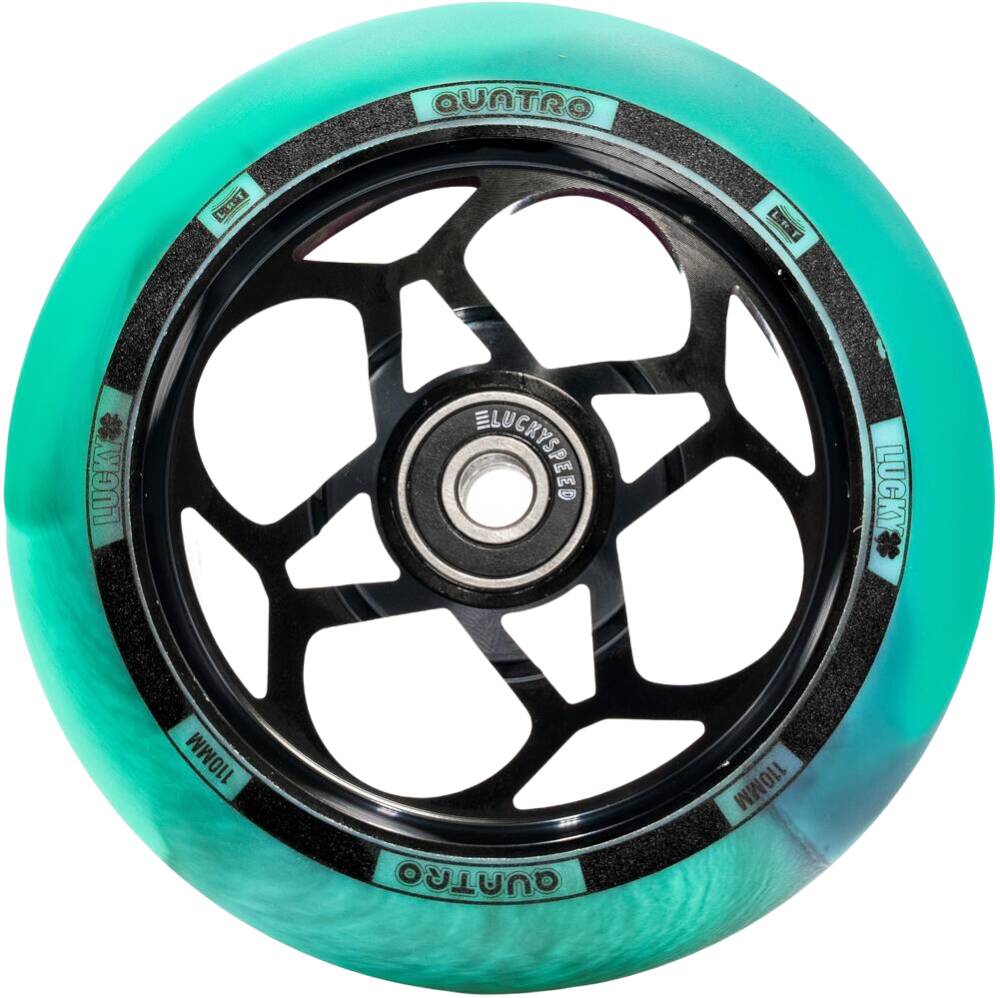 The Lucky Quatro Pro 110mm Scooter Wheel in Black and Teal boasts a sleek, intricate spoke design with the brand's Rebound Technology. Its black central hub is embellished with text and geometric patterns, adding to its modern look.
