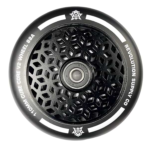 A close-up of the Revolution scooter wheel highlights the ultralite hexagonal pattern on the hub. The outer rim displays "Revolution" and "Cubed Core Ultralite 110mm Stunt Scooter Wheel." These scooter wheels blend modern, sleek design with advanced cube core technology.