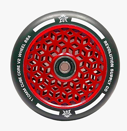 A close-up of a Revolution scooter wheel highlights the Cubed Core Ultralite design. The wheel displays a red geometric cube core surrounded by black rubber edges, with "Revolution Cubed Core Ultralite 110mm Stunt Scooter Wheel - Red" clearly visible around the perimeter.