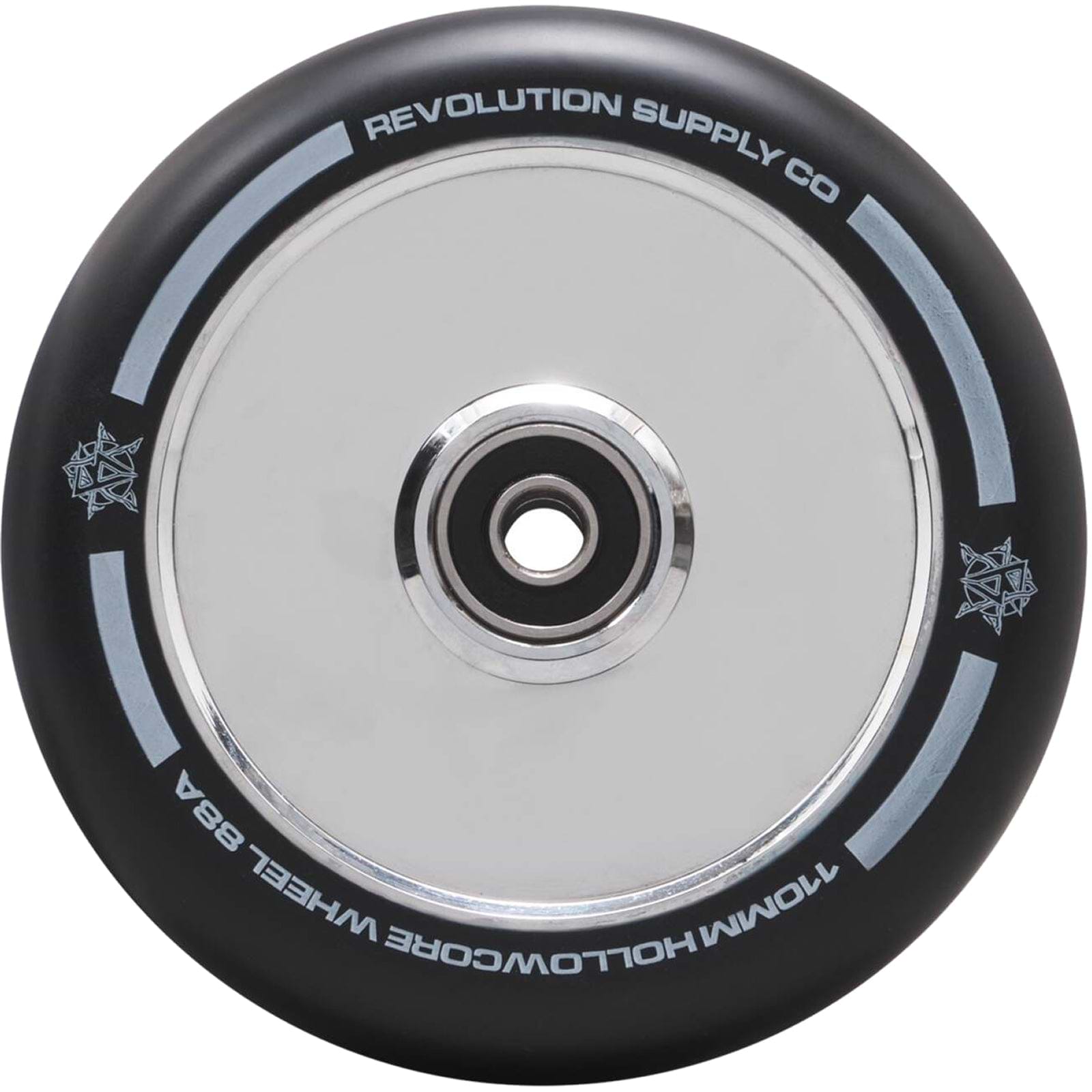 A close-up of a Revolution Hollowcore 110mm Stunt Scooter Wheel - Chrome showcases its black appearance with a metallic center bearing, displaying the words "Revolution Supply Co" and "110MM Hollowcore Wheel 88A" on the rim. This design by Revolution features a subtle star pattern along the edge.