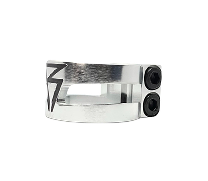 Introducing the Revolution Super Lite 2 Bolt Oversized Stunt Scooter Clamp - Chrome by Revolution: a sleek chrome metal clamp, crafted from durable 6061-T6 aluminum, featuring a lightning bolt design and two black screws on the side. Its oversized design ensures a secure fit, all showcased against a plain white background.