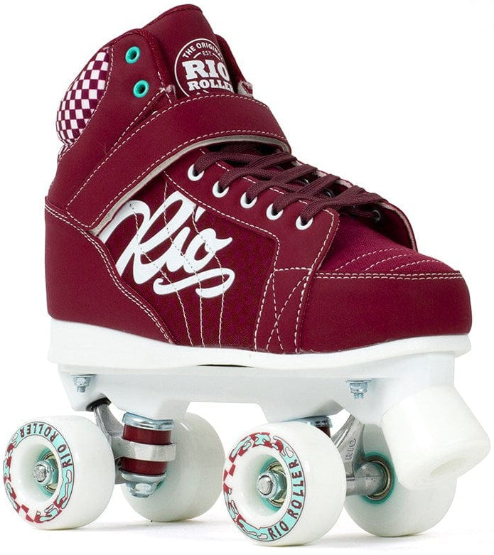 The Rio Roller Mayhem II Quad Roller Skates in red from Rio Roller feature white wheels and laces, stylish checkered accents on the ankle, and a prominent "Rio" logo. The high-top sneaker design is enhanced with teal eyelets and a hi-impact chassis, making it ideal for derby-style skating.