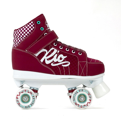 The Rio Roller Mayhem II Quad Roller Skates - Red, crafted in a roller derby style, showcase a checkered ankle pattern and feature the iconic "Rio" logo. The durable Hi-Impact Chassis paired with a white sole is highlighted by four white wheels accented with eye-catching red and blue details, capturing the essence of the Rio Roller Mayhem spirit.