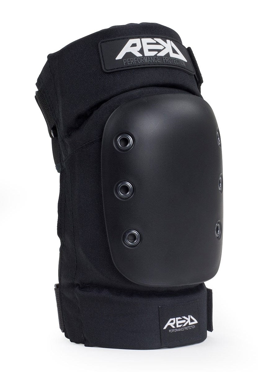 The REKD Pro Ramp Skate Protection Knee Pads in black boast a hard protective shell with six rivets. They feature adjustable straps and include the branding "REKD" and "Performance Protection." These pads are designed with ergonomic knee recesses to ensure safety during activities such as skating or BMX.