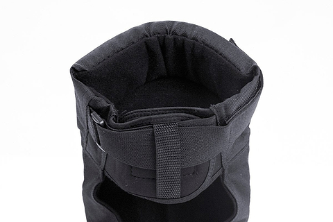 Top view of a black insulated winter boot with a drawstring closure, highlighting its cushioned interior and reinforced fabric for warmth and durability, akin to the protection offered by REKD Pro Ramp Skate Protection Knee Pads - Black.