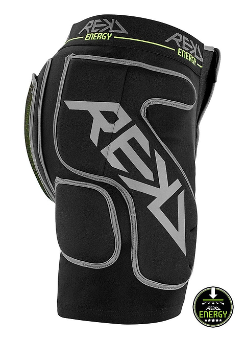 The REKD Energy Impact Skate Protection Shorts - Black feature black padded crash pants with gray branding and logos, offering protective padding on the sides and back. These shorts include a coccyx bone protector for enhanced safety, with a small circular "Energy" logo at the bottom.