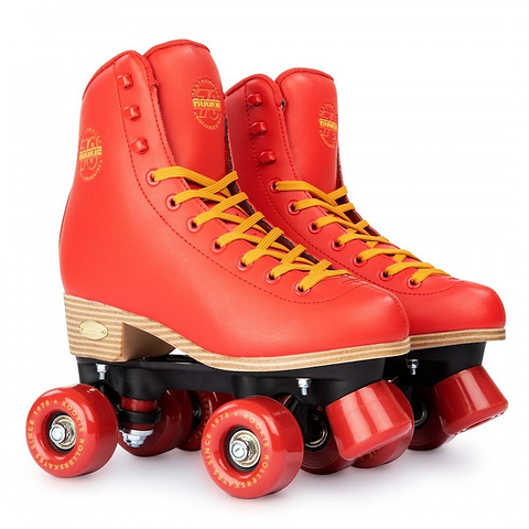 A pair of Rookie Classic 78 Quad Roller Skates in a vibrant red color, featuring yellow laces and red wheels set against a white backdrop. These skates by Rookie boast a vintage design with wooden soles and are crafted to be vegan-friendly.