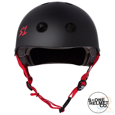 The S1 Lifer Skate / Scooter Helmet in matte black features EPS Fusion Foam technology, red straps, and a small red "S1" logo on the front. It is equipped with several ventilation holes and a padded interior. Additionally, a circular "S-One Helmet Co" logo appears in the bottom right corner of the image.