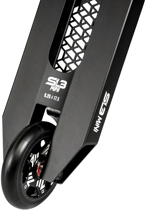 Close-up of the CORE SL3 Mini Complete Stunt Scooter deck in black, featuring a honeycomb cutout design and white “SL3 MINI” text near the rear wheel and along the side—ideal for riders searching for their first stunt or park scooter from CORE.