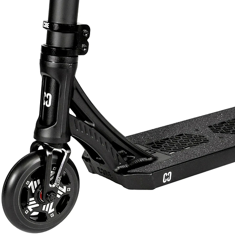 Close-up of the CORE SL3 Mini Complete Stunt Scooter in black, highlighting the front wheel, fork, and a section of the deck with textured grip tape featuring “C3” branding—an ideal mini complete scooter designed for park scooter enthusiasts by CORE.