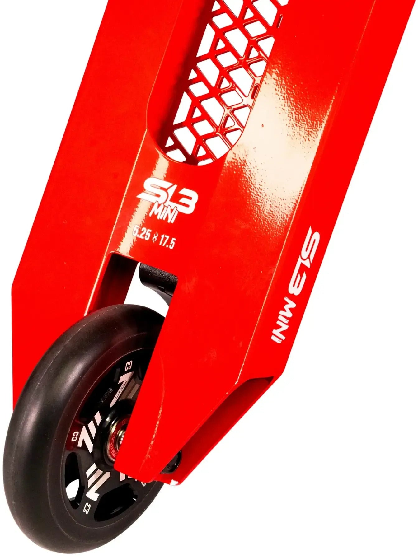Close-up of the rear wheel and red deck of the CORE SL3 Mini Complete Stunt Scooter by CORE, featuring hexagon cutouts and white text reading “S3 MINI 25 x 17.5” on the side—a perfect park scooter for kids.