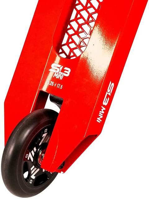 Close-up of the rear wheel and red deck of the CORE SL3 Mini Complete Stunt Scooter by CORE, featuring hexagon cutouts and white text reading “S3 MINI 25 x 17.5” on the side—a perfect park scooter for kids.