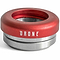 A red and silver metal component from the Drone brand, specifically the Drone Synergy 2 Integrated Stunt Scooter Headset, is crafted from 6061 aluminum. The word "DRONE" is printed on it, and it showcases cylindrical shapes with inner grooves similar to those of a stunt scooter headset. It includes smooth bearings and is displayed against a white background.