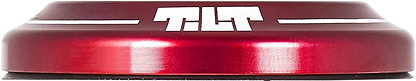 Close-up of a Tilt Integrated Stunt Scooter Headset in metallic red with a rounded edge, featuring the Tilt brand name in bold white letters on the side. The surface is shiny and reflective, showcasing anodized dust covers that enhance its minimalist design.